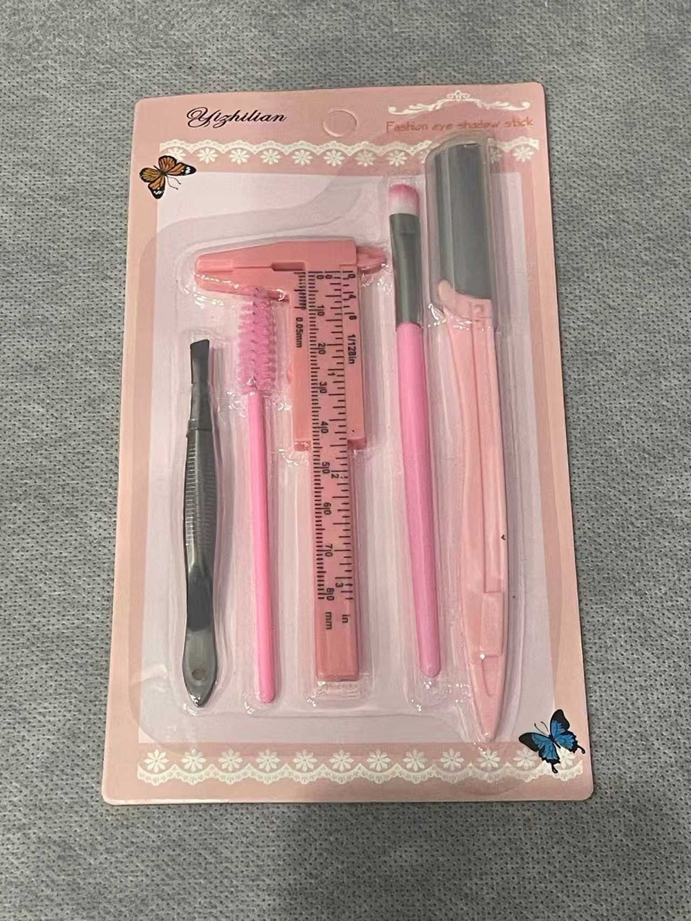 Makeup/beauty tool set on pink card